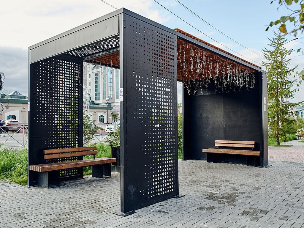 Metal bus shelter perforated