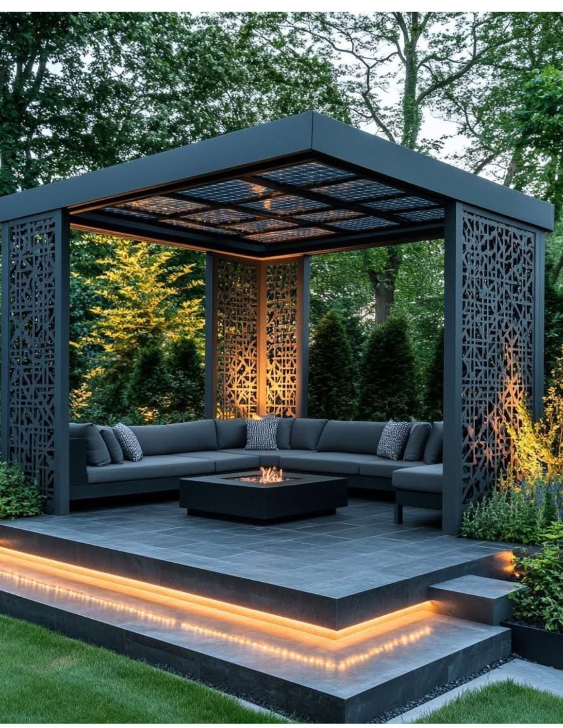 Pergola with laser-cut screens at night